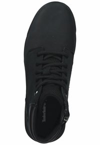Black high-top sneaker featuring a smooth leather upper, textured mesh sections, lace closure, and logo on the insole.