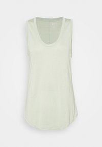 Svetle zelený top bez rukávů s kulatým výstřihem. Měkký materiál, volný design a mírně zakřivený spodní lem pro pohodlný střih.