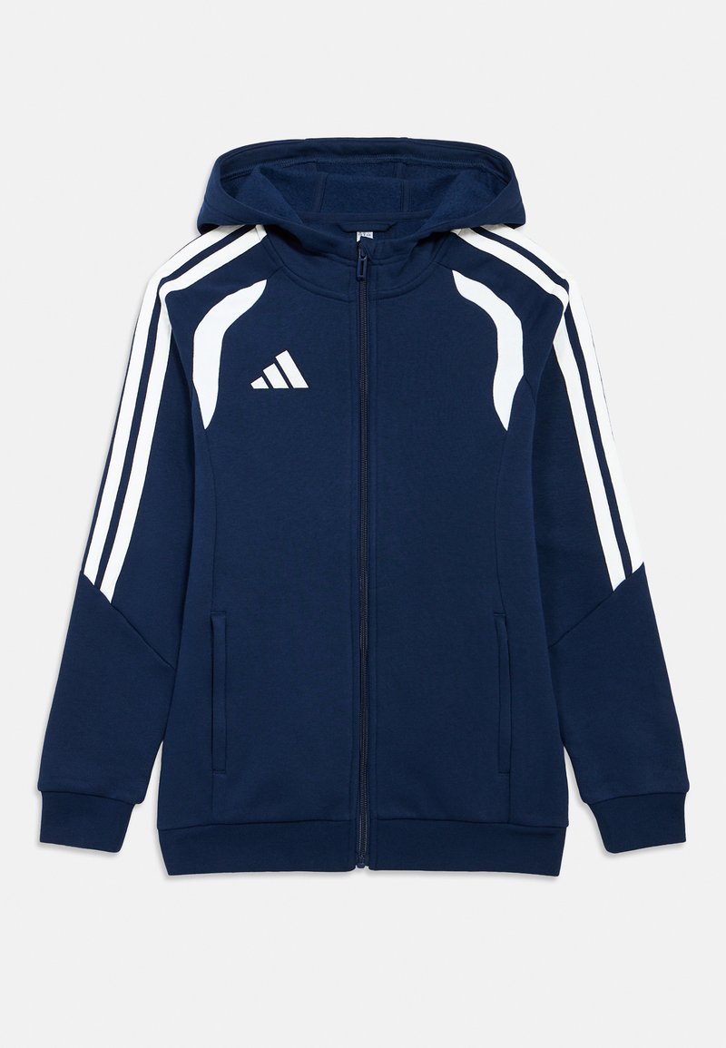 Ναυτικό μπλουζάκι με κουκούλα και λευκές λεπτομέρειες, πλήρες φερμουάρ, δύο πλαϊνές τσέπες και τρεις λευκές ρίγες στους ώμους. Φέρει το λογότυπο της Adidas στο στήθος.