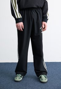adidas Originals Tracksuit bottoms - black
