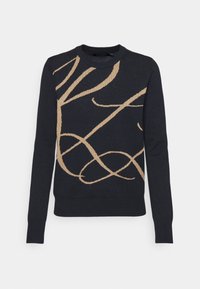 Marinblå stickad tröja med ett guld-abstrakt mönster, rundad halsringning, långa ärmar och ribbade muddar och nederdel. Slät struktur.