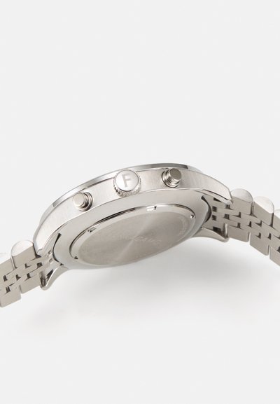 Silver stainless steel watch with a brushed finish, two side buttons, a circular case, and a linked bracelet design.