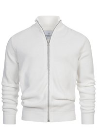 Valkoinen vetoketjullinen neuletakki, jossa on teksturoitu kuvio, joustavat hihansuut, korkea kaulus ja kontrastivärinen vetoketju. Pehmeää neulekangasta.