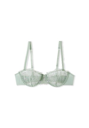 Green lace bra with embroidered floral design, featuring an underwire structure, adjustable straps, and polka dot textured band.