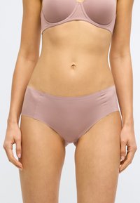 Ružové plné nohavičky so širokým prekrytím, vyrobené z hladkej tkaniny, bezšvového dizajnu a elastickým pásom pre pohodlie a priliehavé nosenie.