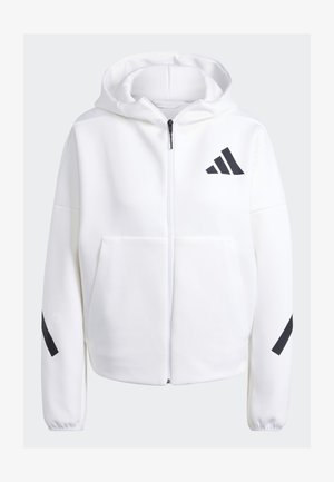 White zip-up hoodie with black accents, large front pockets, soft textured fabric, and a relaxed fit. Features a hood and brand logo on chest.