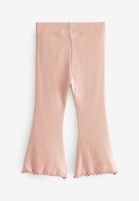 Világos rózsaszín bordás leggings, amely enyhén harang alakú, a szegélyén fodros élekkel. Puha, rugalmas anyag, amely a kényelmet szolgálja.