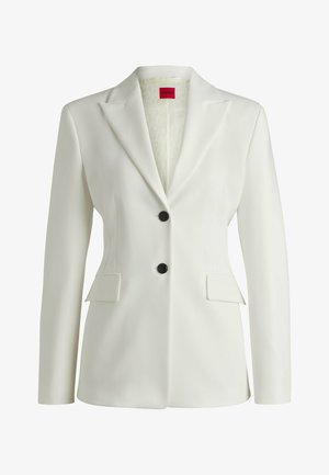 White blazer made of smooth fabric, featuring a single-breasted design, two front pockets, and two black buttons. Interior has a patterned lining.