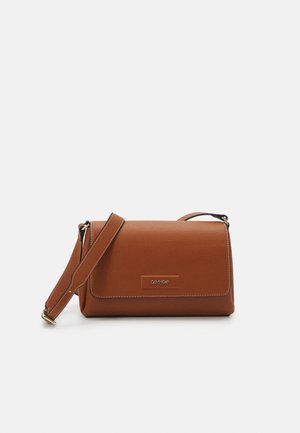 Brown leather crossbody bag with adjustable strap and flap closure, featuring small Calvin Klein logo on front.