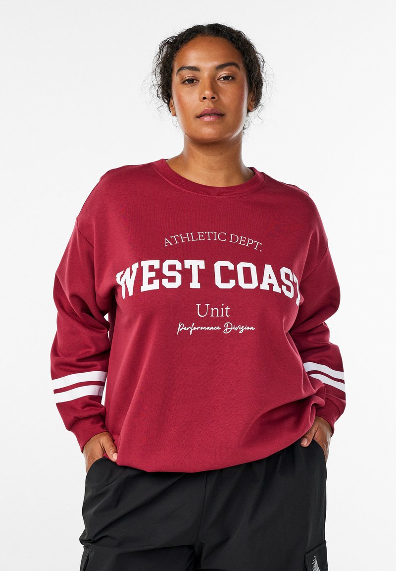 Bordeaux sweatshirt med lange ærmer, med hvid "WEST COAST" tekst og stribede detaljer på ærmerne. Afslappet pasform, lavet af bomuldsmateriale.