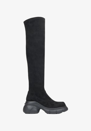 Schwarze knielange Stiefel aus weichem Wildleder. Mit einer robusten schwarzen Gummisohle und einem eleganten, glatten Design mit minimaler Naht.