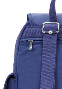Blue fabric backpack featuring a zippered pocket, textured straps, and a metallic buckle accent. Smooth finish with sturdy stitching details.