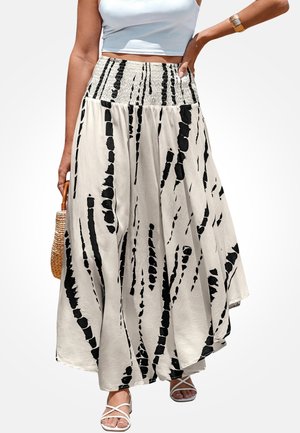 Maxi spódnica wykonana z lekkiego, kremowego materiału z wyraźnymi czarnymi abstrakcyjnymi paskami. Elastyczny pas z marszczeniem i zwiewna sylwetka.