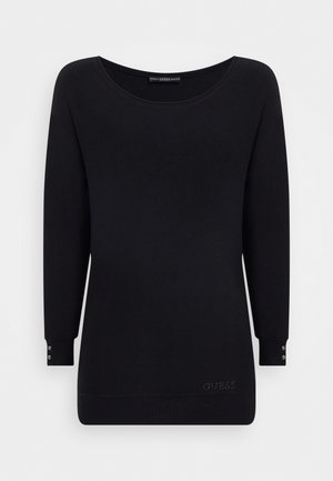 Maglione nero a maniche lunghe in morbido tessuto con scollo a barca, caratterizzato da bottoni ai polsini e logo "GUESS" ricamato in fondo.