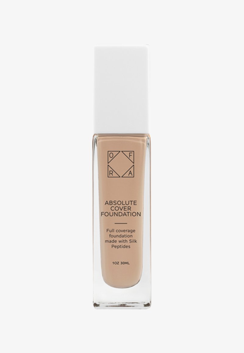 Fond de teint liquide couvrant dans un flacon en verre rectangulaire transparent avec un bouchon blanc étiqueté Absolute Cover Foundation.