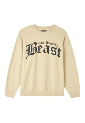 Felpa oversize beige realizzata in tessuto morbido, con una scritta grafica nera "Los Angeles Beast" sul davanti, colletto rotondo e polsini a costine.