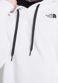 The North Face Mikina s kapucí - white
