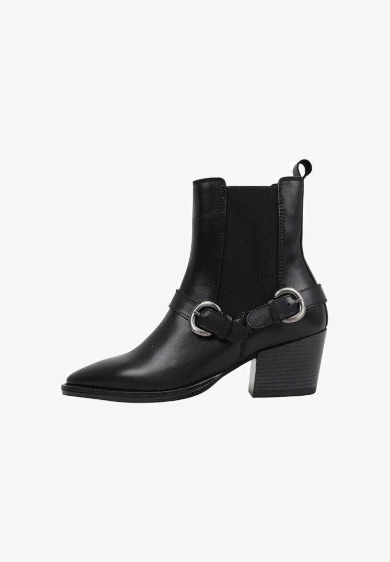 Black leather ankle boots with a pointed toe, elastic side panels, double strap with silver circular buckles, and a stacked heel.
