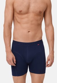 Marineblauwe boxershort gemaakt van zachte stof, met een snug fit, elastische tailleband met de tekst "ENDURANCE" en subtiele stiksels.