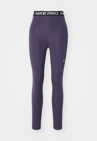 Nike Pro Leggings in Dunkelpurpur, aus dehnbarem Material. Merkmale einen schwarzen Bund mit "NIKE PRO" Logo und einem kleinen weißen Nike-Swoosh.