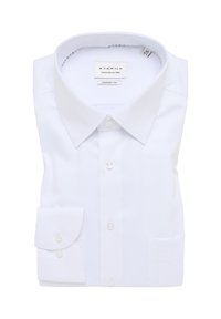 Camicia ETERNA bianca, taglio comfort, piegata con colletto classico, polsini con un bottone e una texture liscia e morbida.