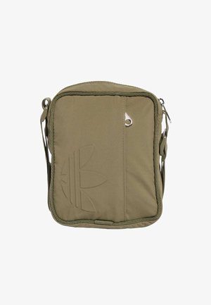 Olive green crossbody bag made of durable fabric. Features a textured front with an embossed logo, zip closure, and adjustable strap.