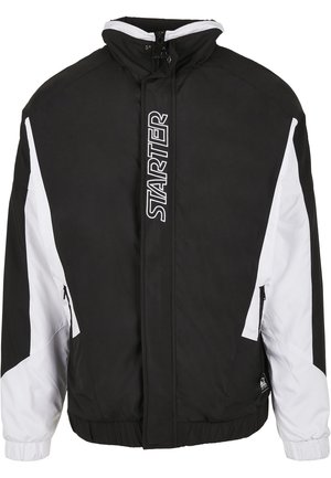 Black and white zip-up jacket with high collar, elastic cuffs, side pockets, and "STARTER" logo in white lettering on front zipper area.
