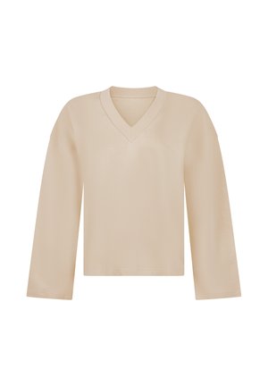 Beige lange mouw V-hals trui met een losse pasvorm en geribbelde halslijn, weergegeven op een witte achtergrond.