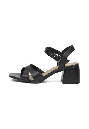 Sandale en cuir noir à bout ouvert avec brides croisées à l'avant, bride de cheville réglable avec boucle argentée et petit talon bloc.