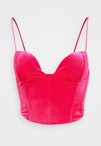 Top in velluto rosa con scollo a V profondo, spalline sottili e regolabili, e coppe strutturate. Presenta cuciture verticali per una silhouette aderente.
