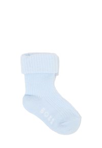 Calza a coste blu chiaro con un risvolto. Presenta una texture morbida e la scritta del marchio bianca sulla pianta.