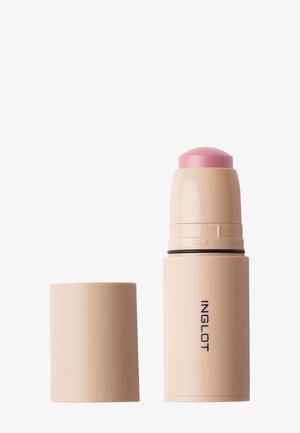 Fond de teint ou blush en stick beige avec un haut rose et un capuchon assorti retiré, étiqueté Inglot sur le contenant.