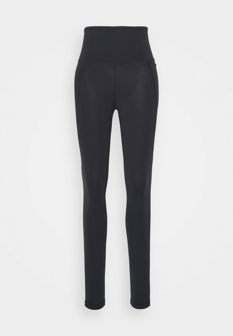Svarte leggings med høy midje, laget av elastisk stoff. Har en jevn tekstur og en tettsittende design. Ingen synlige sømmar eller logoer.