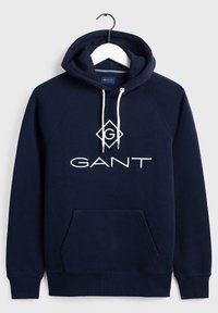 Felpa blu navy in morbido tessuto con tasca a marsupio, cappuccio con coulisse e logo "GANT" ricamato in bianco sulla parte anteriore.