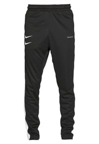 Svarta träningbyxor med vita sidosträck, elastisk midja och Nike Swoosh-logga på framsidan, tillverkade av ett slätt, stretchigt material.