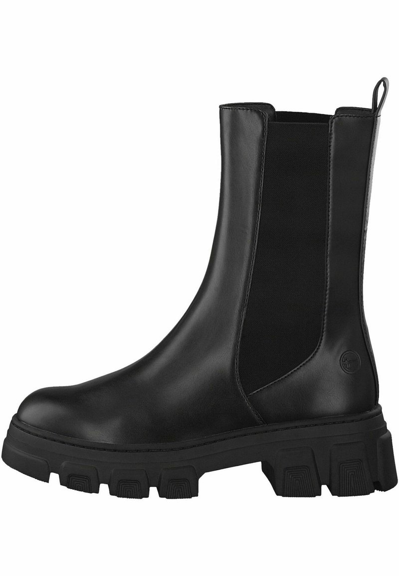 Bottine en cuir noir avec panneaux latéraux élastiques, bout rond et semelle en caoutchouc texturée avec des rainures profondes pour une bonne adhérence.