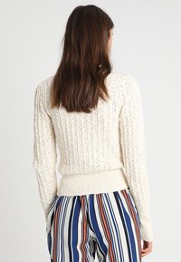 Free People Strickpullover - beige