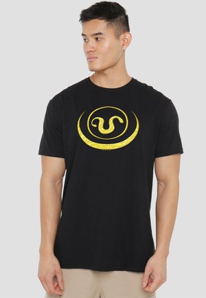 Black cotton t-shirt featuring a large gold graphic logo in the center. Short sleeves and a classic crew neck design.