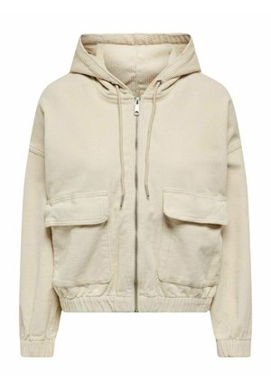 Sweat à capuche zippé en velours côtelé beige avec capuche à cordon, deux grandes poches avant à rabat, poignets élastiques et ourlet élastique.