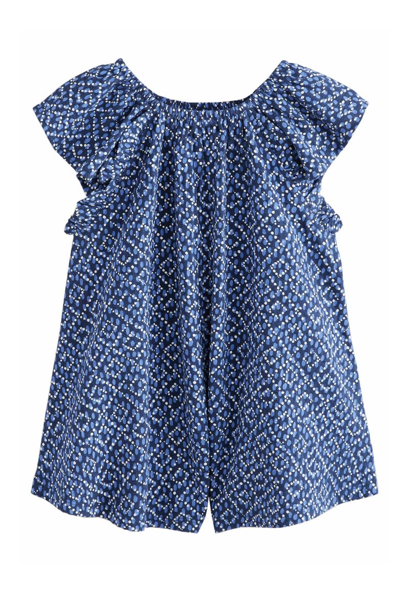 Haut bleu à motifs avec des manches volantées, présentant un design en diamant et points blancs. Tissu doux, coupe ample et encolure élastiquée.