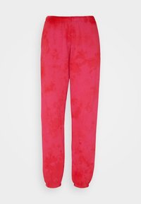 Sweatpants i lys pink med et tie-dye mønster. Elastisk talje og manchetter, lavet af blødt stof. Løs pasform, velegnet til afslappet brug.