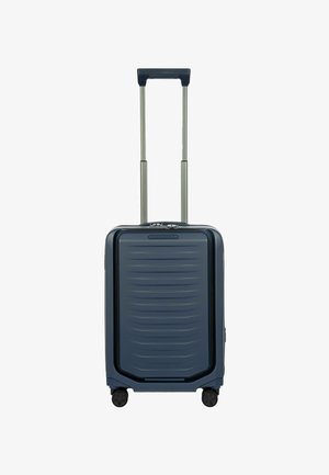 Valise rigide bleu marine, présentant un motif rayé texturé, une double poignée rétractable, quatre roues et un compartiment latéral zippé.