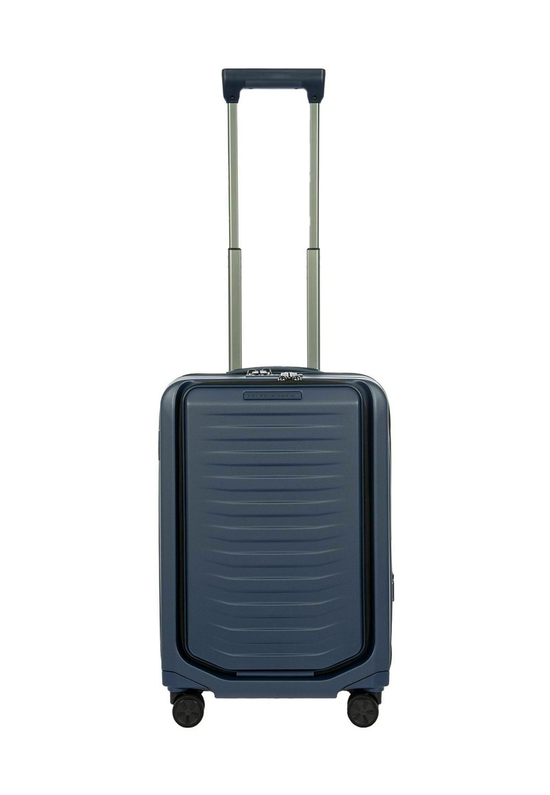 Valigia rigida di colore blu navy, con un motivo a strisce testurizzato, doppio manico retrattile, quattro ruote e un compartimento laterale con zip.