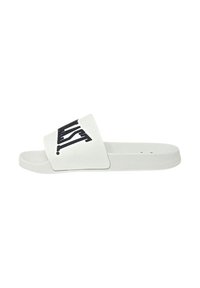Infradito bianchi con una larga fascia caratterizzata da un design testuale grafico nero. Materiale liscio, suola piatta e stile aperto sulla punta.