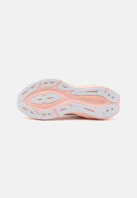 Light pink athletic shoe sole with textured rubber gripping pattern, featuring white accents and a flexible design for traction.