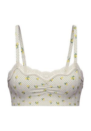Reggiseno realizzato in morbido tessuto crema con pois neri e disegni di limoni gialli. Presenta un bordo in pizzo e spalline regolabili.