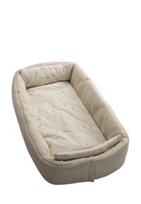 Baby nest with a woven textured exterior in beige, featuring a soft, patterned interior with moon and star designs. Cushioned edges for comfort.