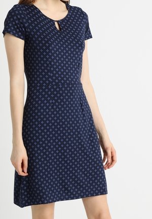 Abito blu navy con maniche corte, caratterizzato da un collo a chiave e piccoli motivi azzurri. Silhouette a forma di A con texture liscia.