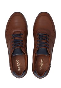 Brown leather sneakers with navy accents, round toe, lace-up design, textured panels, and "Venezia" logo on the insoles.