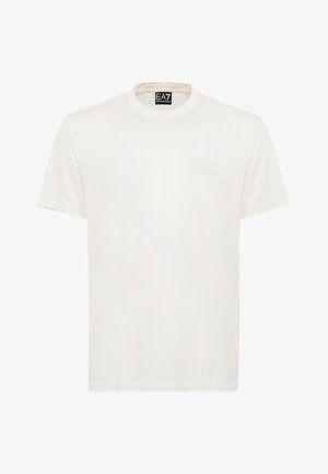 T-shirt bianca a maniche corte con scollo tondo, con un logo in rilievo sottile sul petto e l'etichetta EA7 Emporio Armani all'interno del collo.